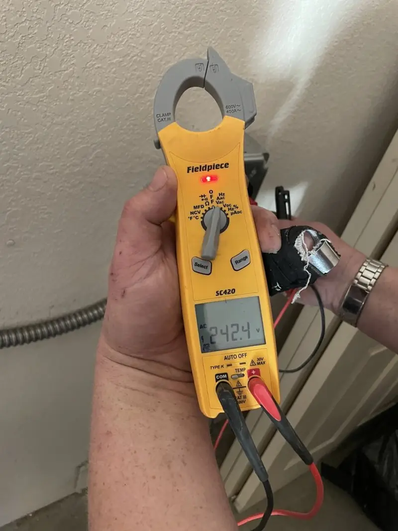 Voltage testing with clamp meter during Outlet Installation in Wilson's Mills